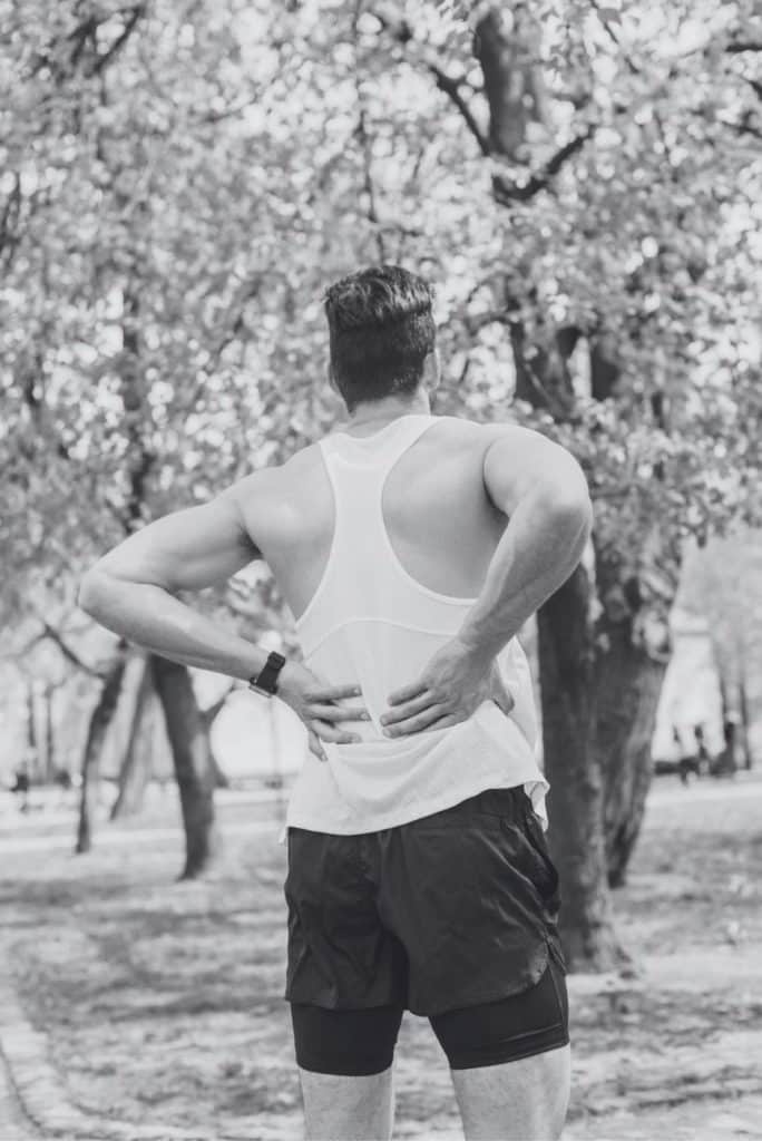 Man holding his back