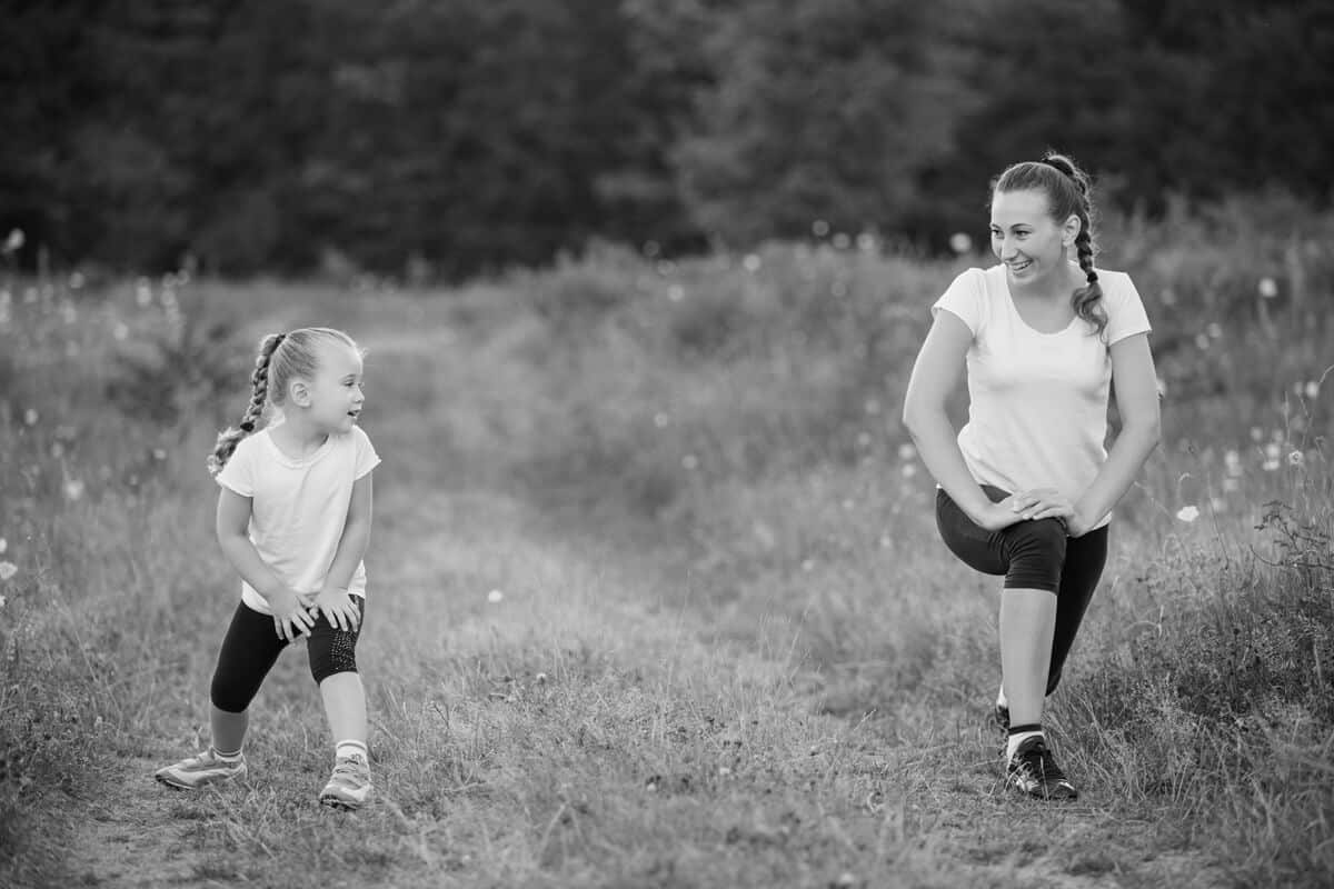 Mom and daughter stretching